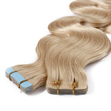 22 Inch Tape in Human Hair Extensions Wavy Thin Long Hair 50g 20pcs/pack Seamless Skin Weft Glue in Body Wave Human Hairpieces with Invisible Double Sided Tape #613 Bleach Blonde